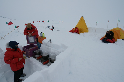 The camp kitchen is dug into the snow, with wind-breaks made of snow blocks. (click to enlarge)