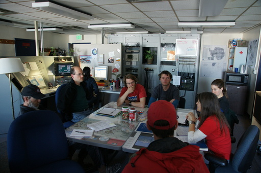 Our meeting with MacOps to discuss communication. That\'s Loomy on the left, and Shelly, the MacOps supervisor in bright red. You should recognise the rest of the people by now. (click to enlarge)