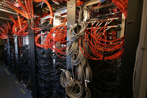 Part of the maze of cabling required to link the Ice Cube photomultipliers to the data analysis computers. (click to enlarge)