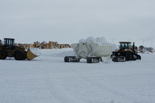 Moving snow to stop buildings being covered is a never-ending job. (click to enlarge)