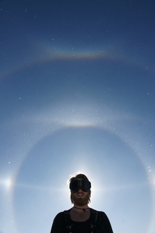 Luke blocking the sun, with an incredible display of ice halos around him. (click to enlarge)
