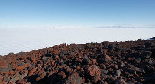 A view across the Ross Sea ice-shelf, with the volcanic rocks of Observation Hill in the foreground. (click to enlarge)