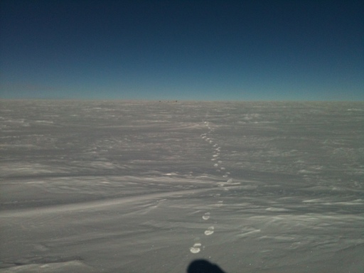 PLATO-A/HEAT at Ridge A appears as two black dots on the horizon in this photograph taken by Luke Bycroft. (click to enlarge)