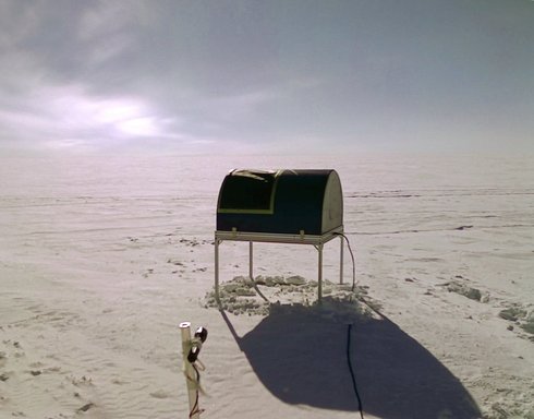 An image from one of the seven webcameras on the roof of the Instrument Module, showing the HEAT telescope. The device on the pole in the foreground is a flashlight that can be used to illuminate HEAT when it is dark. (click to enlarge)
